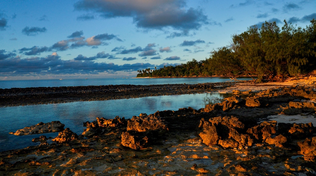 Remote tropical beach on the sunset with rocks on the Desroches Island, Seychelles