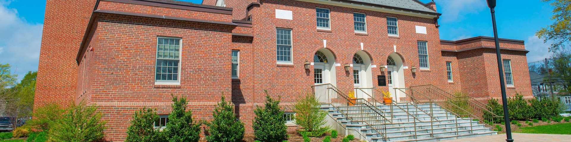 Tewksbury Town Hall in spring at 1009 Main Street on Town Common in historic town center of Tewksbury, Middlesex County, Massachusetts MA, USA.