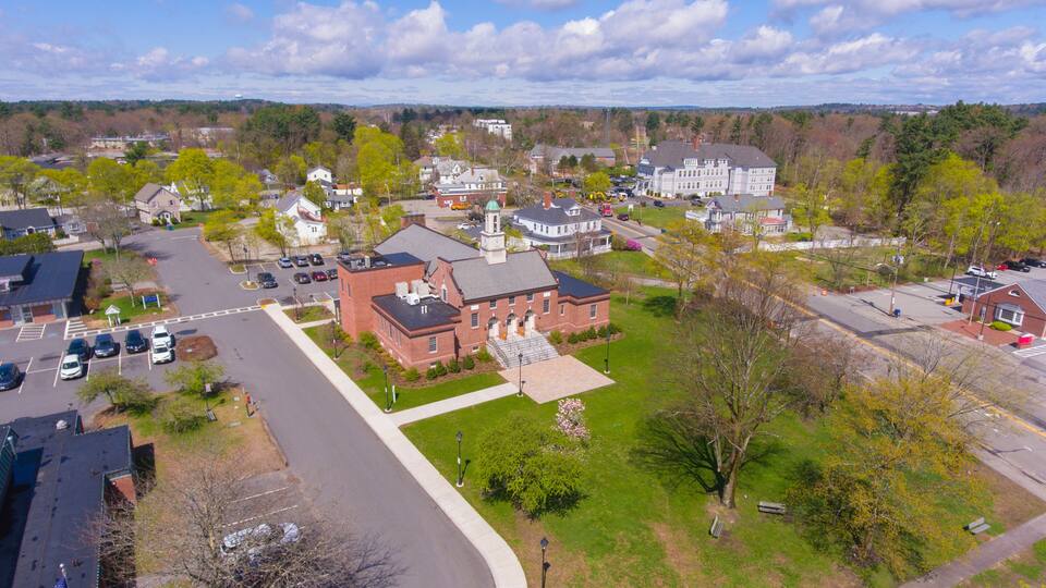 Tewksbury Town Hall aerial view in spring at 1009 Main Street on Town Common in historic town center of Tewksbury, Middlesex County, Massachusetts MA, USA.