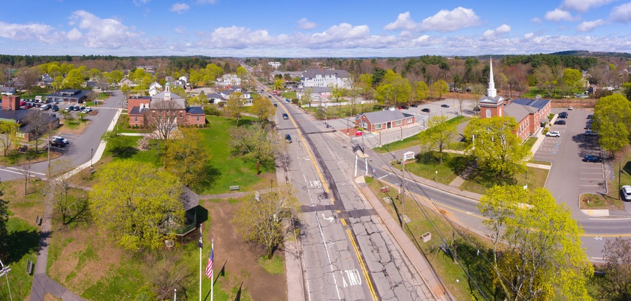 Tewksbury Town Hall and Congregational Church aerial view in spring on Town Common in historic town center of Tewksbury, Middlesex County, Massachusetts MA, USA.