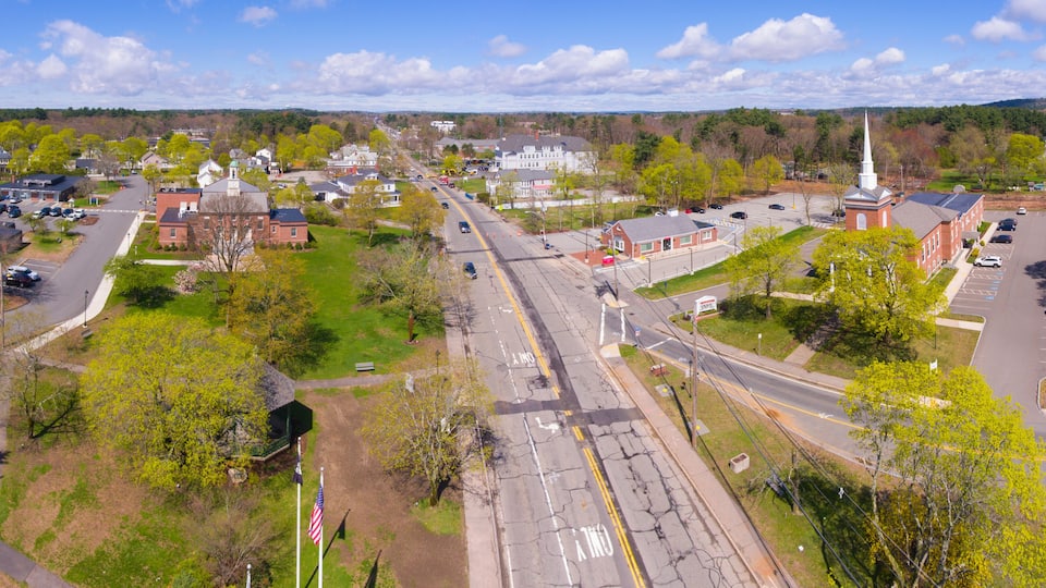 Tewksbury Town Hall and Congregational Church aerial view in spring on Town Common in historic town center of Tewksbury, Middlesex County, Massachusetts MA, USA.