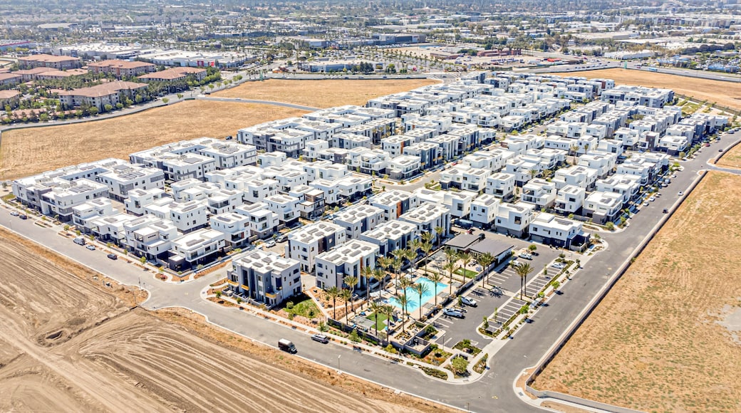 Tustin, California, Orange County - July 30, 2024: Aerial Drone Tustin Irvine View Photo toward Barranca Pkwy, Warner Ave, Red Hill Ave, Tustin Legacy Community with Apartment, House, Home, Town, Stre