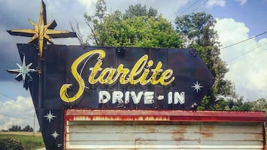 A 'Starlite Drive-In' sign with a star and a movie marquee.