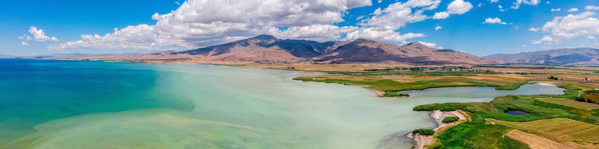 Aerial view of Lake Van the largest lake in Turkey, lies in the far east of that country in the provinces of Van and Bitlis. Fields and cliffs overlooking the crystal clear waters