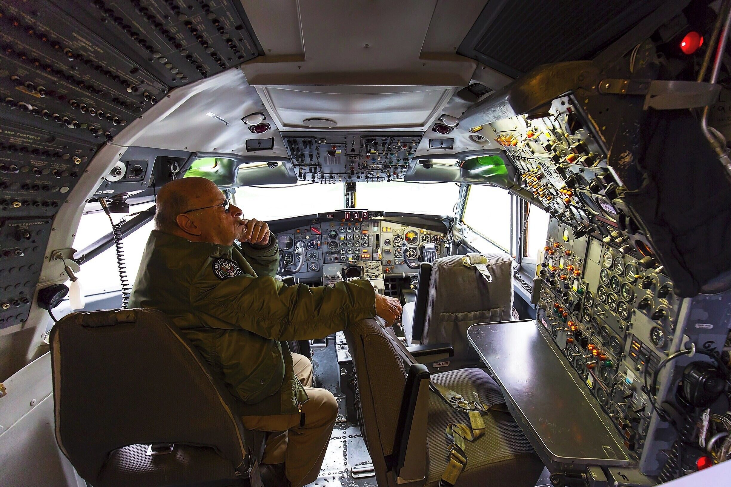 Restored cockpit of Boeing's first 727.  Notice the third seat, for the flight engineer - a position which todays more automated planes no longer require.  Back in the day, the flight engineer was responsible for much of the plane's mechanical operation, including engines, fuel, electronics, hydraulics, lights, HVAC and more.  It was considered an entry level position before you could graduate to first officer or pilot.