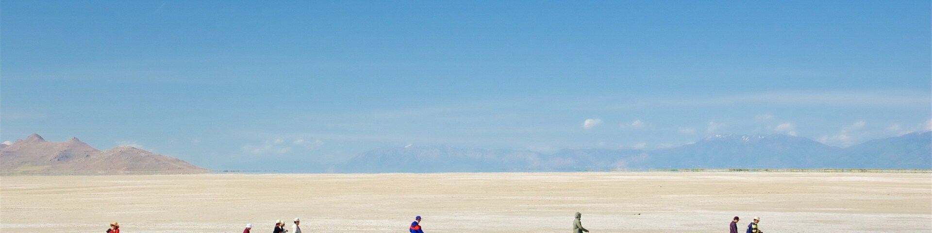 Tooele featuring a lake or waterhole as well as a small group of people