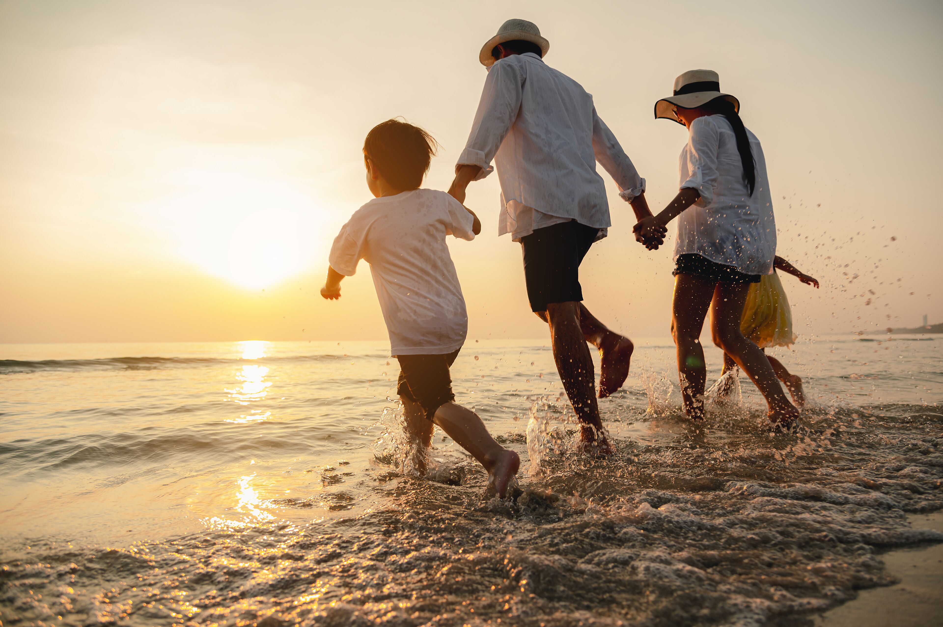 Family holiday vacation beach. Asian happy family outdoors summer travel. Fun families outdoors. Family vacation beach. Happy family beach sunset. Children vacations.
