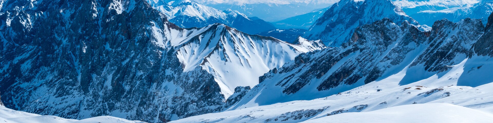 View from the German Zugspitze across the top of a snow mountain landscape
