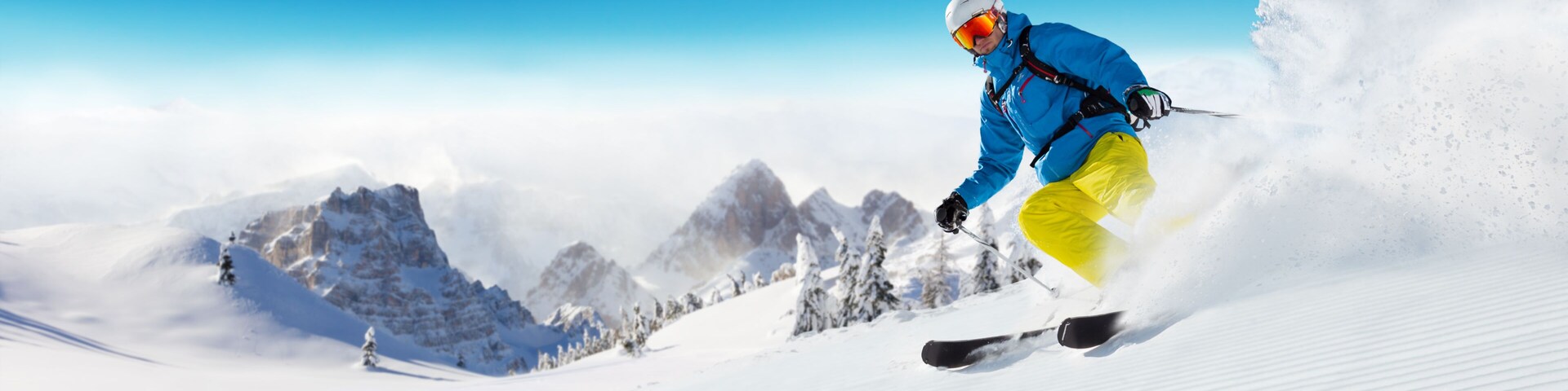 Skier on piste running downhill
