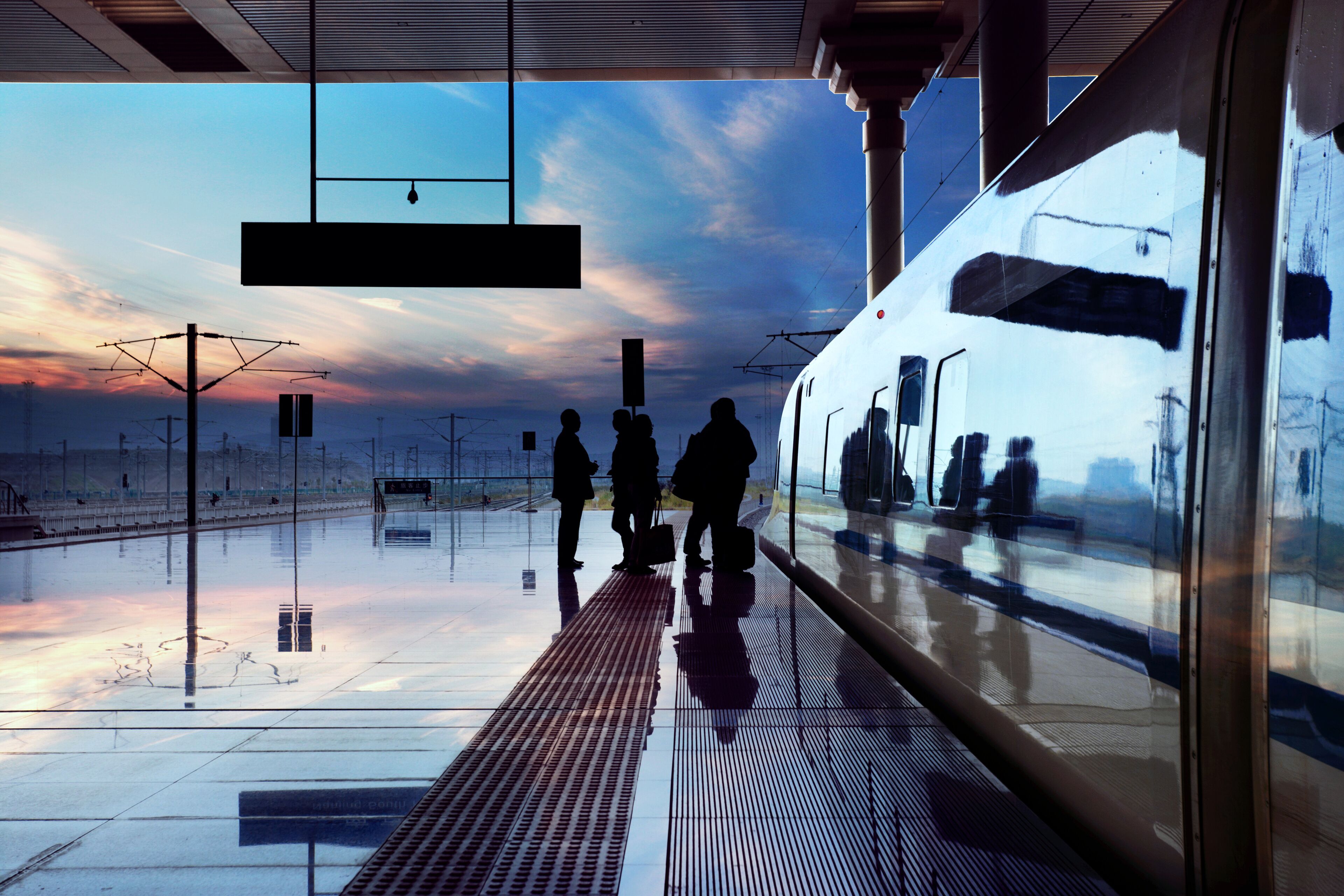 train stop at railway station with sunset