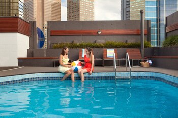 Outdoor pool, open 6 AM to 10:30 PM, pool loungers