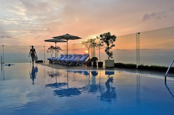 Outdoor pool, open 6:00 AM to 10:00 PM, pool umbrellas, sun loungers