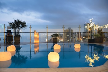 Outdoor pool, open 6:00 AM to 10:00 PM, pool umbrellas, sun loungers