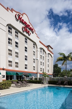 Outdoor pool, open 7:00 AM to 10:00 PM, pool umbrellas, pool loungers