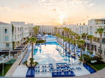 Indoor pool, outdoor pool, pool umbrellas, pool loungers