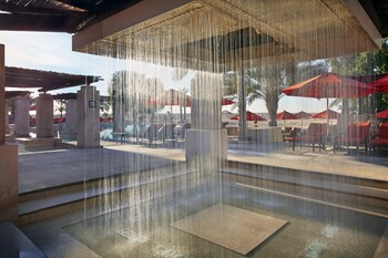 2 outdoor pools, open 8:00 AM to 7:00 PM, pool umbrellas, pool loungers