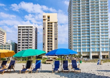 On the beach, white sand, beach towels