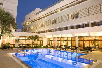 Seasonal outdoor pool, pool umbrellas, pool loungers