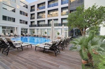 Seasonal outdoor pool, pool umbrellas, pool loungers