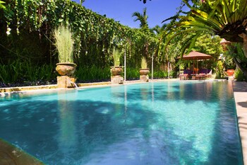 Outdoor pool, open 7:00 AM to 7:00 PM, pool umbrellas, pool loungers