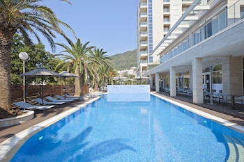 Indoor pool, outdoor pool, pool umbrellas, sun loungers