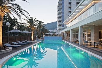 Indoor pool, outdoor pool, pool umbrellas, sun loungers