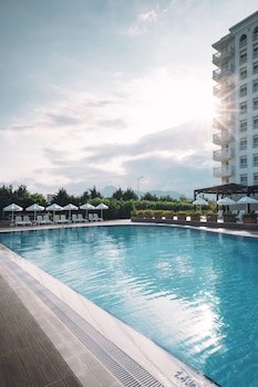Indoor pool, outdoor pool, pool umbrellas, sun loungers