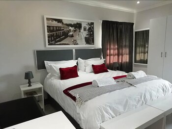 Blackout curtains, iron/ironing board, rollaway beds, free WiFi