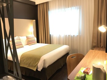 Luxe beddengoed, pillowtop-bedden, een kluis op de kamer