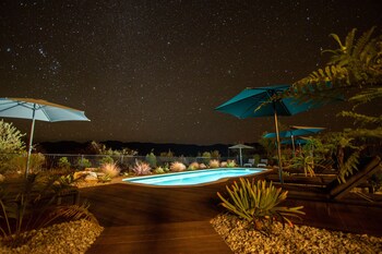 Seasonal outdoor pool, open 8:00 AM to 8:00 PM, pool loungers