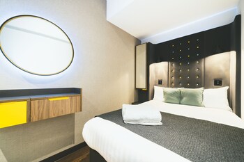 Een kluis op de kamer, verduisterende gordijnen, gratis wifi, beddengoed