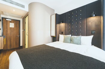 Een kluis op de kamer, verduisterende gordijnen, gratis wifi, beddengoed