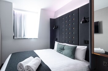 Een kluis op de kamer, verduisterende gordijnen, gratis wifi, beddengoed